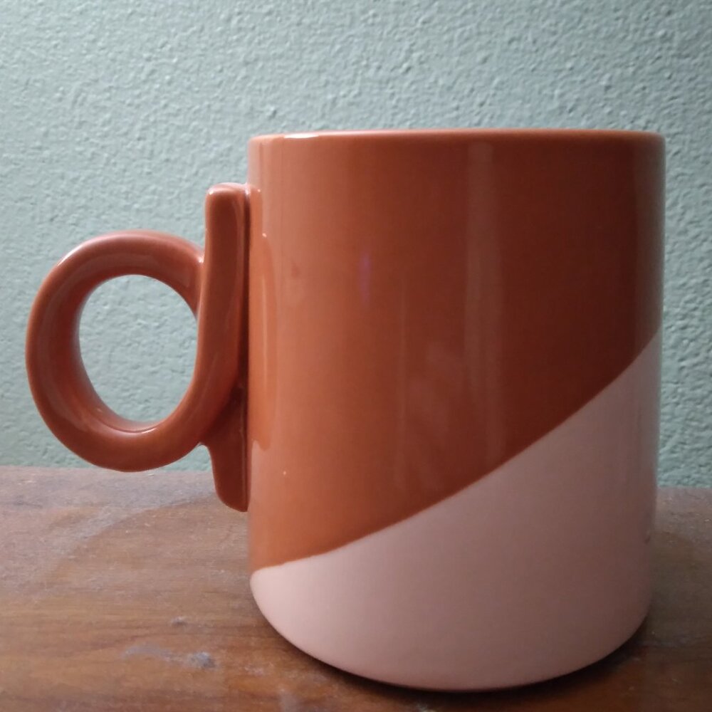 New retro looking coffee mug with cool twist handle.